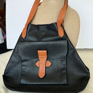 Black leather satchel with tan leather handles